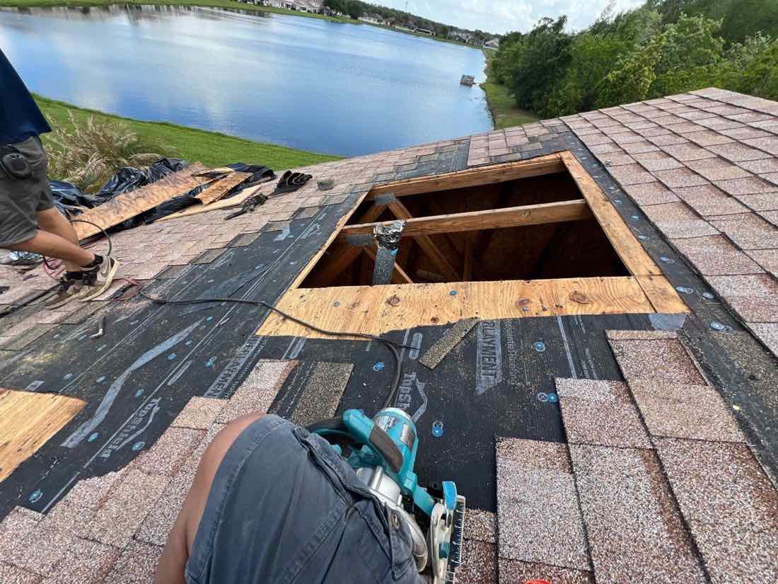 Backsider crew replacing roof decking